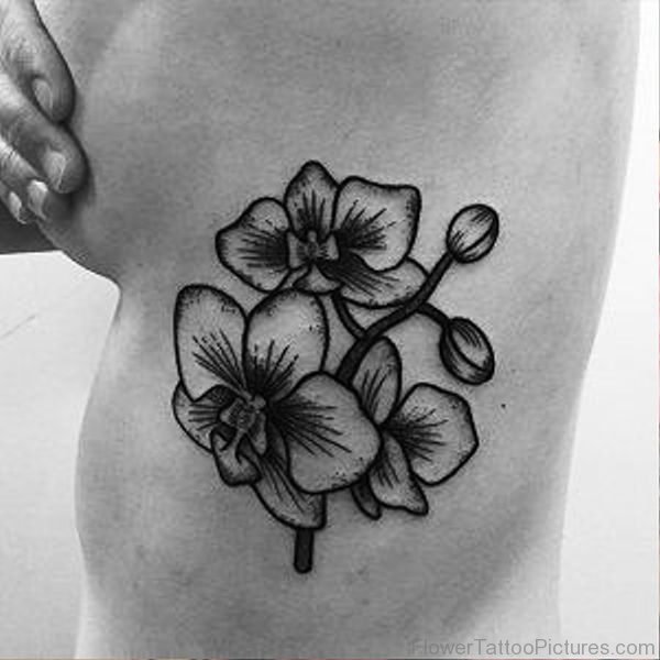 Black And Grey Orchid Flower Tattoo On Rib