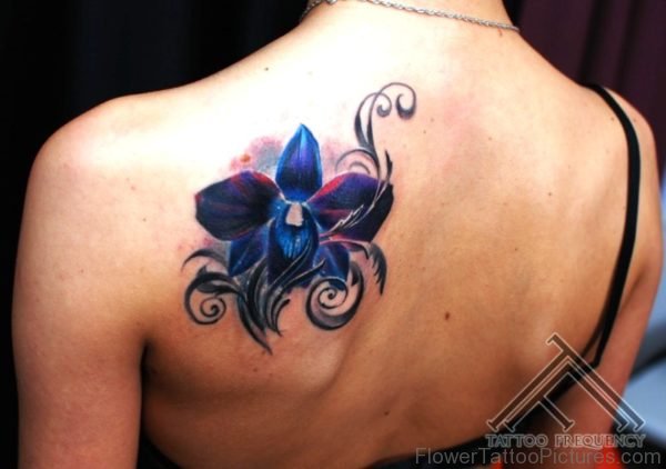 Fantastic Blue Orchid Flower Tattoo On Shoulder