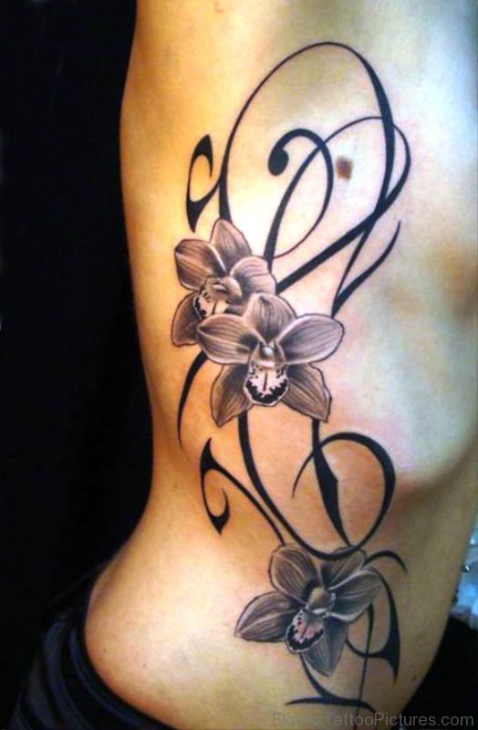Grey Ink Orchid Flowers Tattoo On Rib