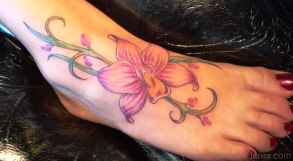 Huge Pink Orchid Flower Tattoo On Foot