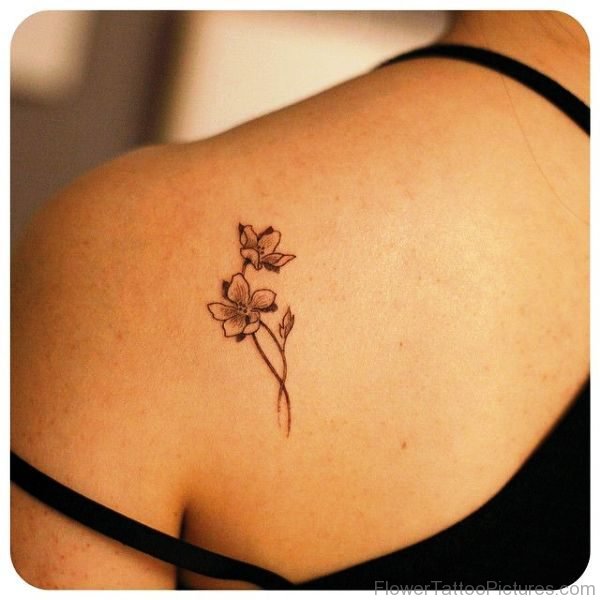 Little Black Outline Orchid Flower Tattoo On Shoulder