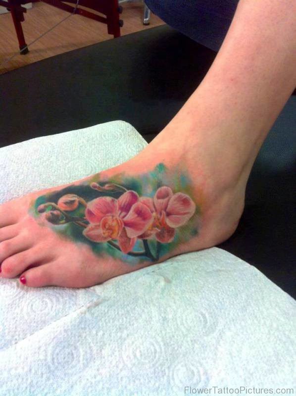 Lovely Pink Orchid Flower Tattoo On Foot