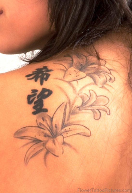 Grey Ink Lily Tattoo