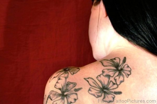 Grey Liliy Tattoo On Back Shoulde