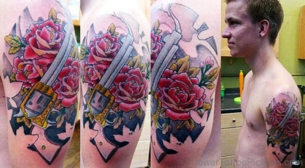 Roses And Gun Shoulder Tattoo