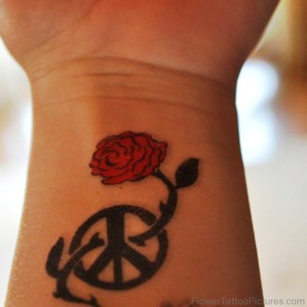 Wheel And Rose Tattoo On Wrist