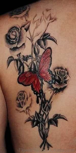 Wonderful Butterfly On Flowers Tattoo