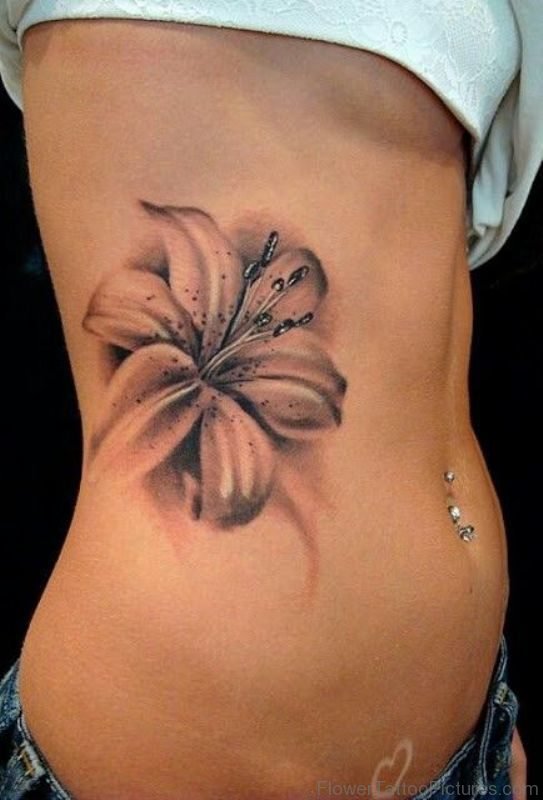Amazing Amaryllis Flower Tattoo On Rib