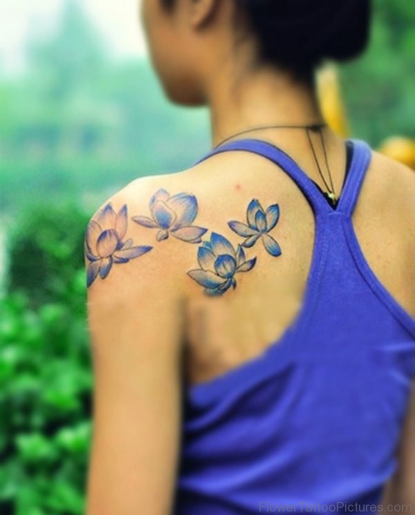 Blue Flower Tattoo On Back Shoulder