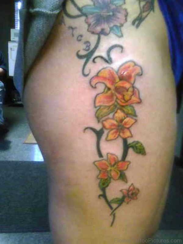 Elegant Amaryllis Flowers Tattoo On Thigh