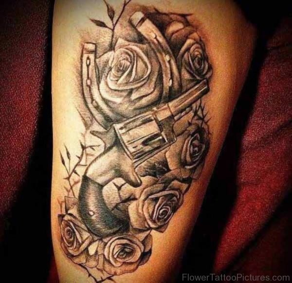 Gun And Rose Tattoo On Thigh