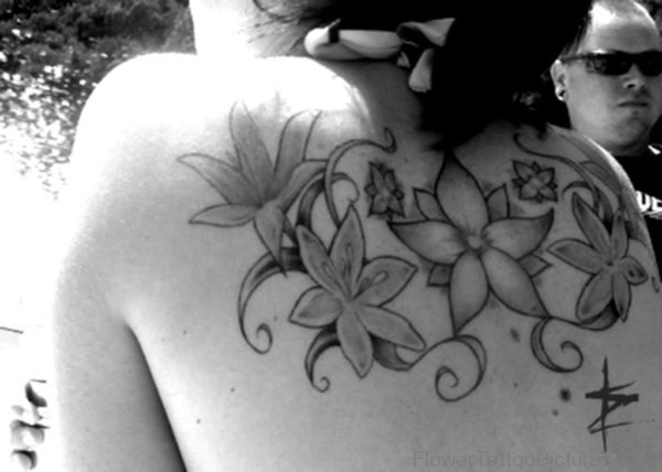 Impressive Lily Flower Tattoo On Back