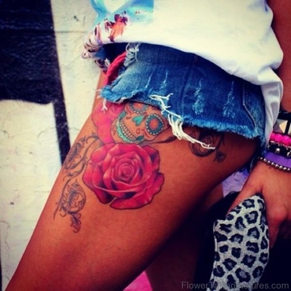 Pink Rose And Skull Tattoo On Thigh