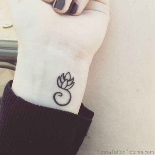 Tiny Lotus Flower Tattoo On Wrist