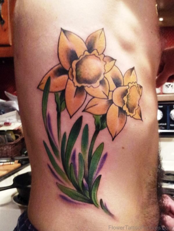 2 Big Daffodil Flowers Tattoo On Rib