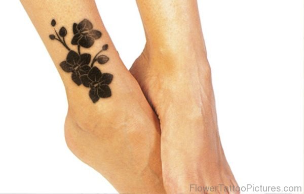 Black Daffodil Flowers Tattoo On Foot