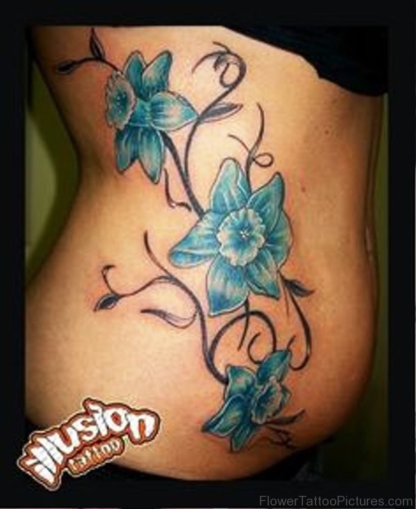Blue Daffodil Flowers Tattoo On Rib