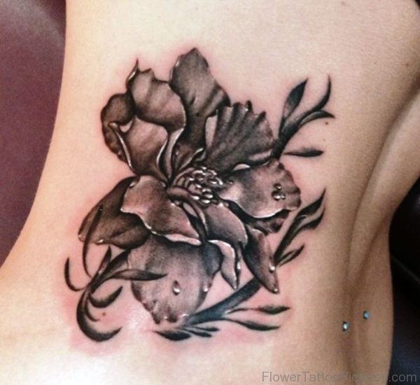 Brown Larkspur Flower Tattoo On Rib