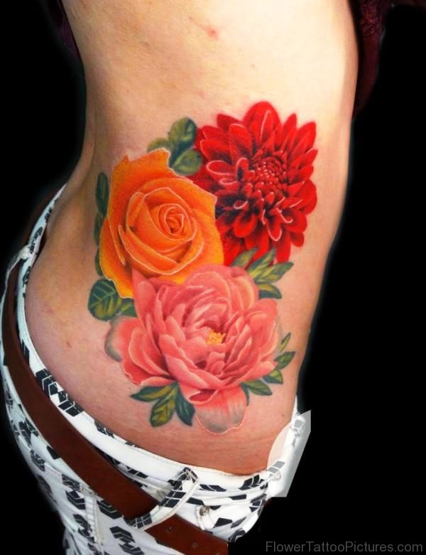 Colorful Carnation Flower Tattoo On Rib