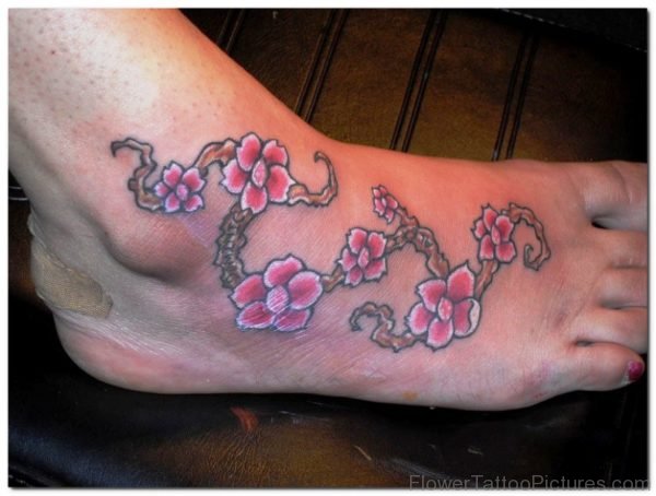 Cute Little Orchid Flowers Tattoo On Foot