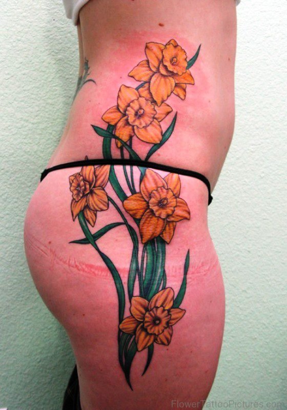 Daffodil Flowers Tattoo On Rib To Thigh