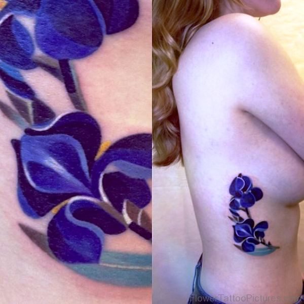 Dark Blue Iris Flower Tattoo On Rib