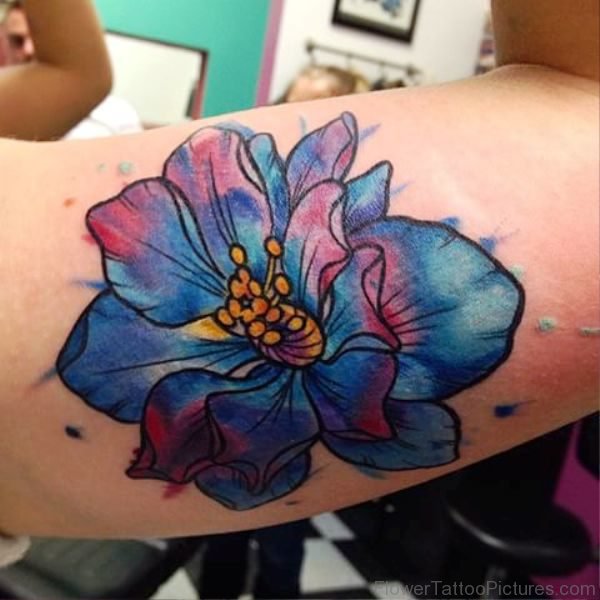 Dazzling Larkspur Flower Tattoo On Biscep