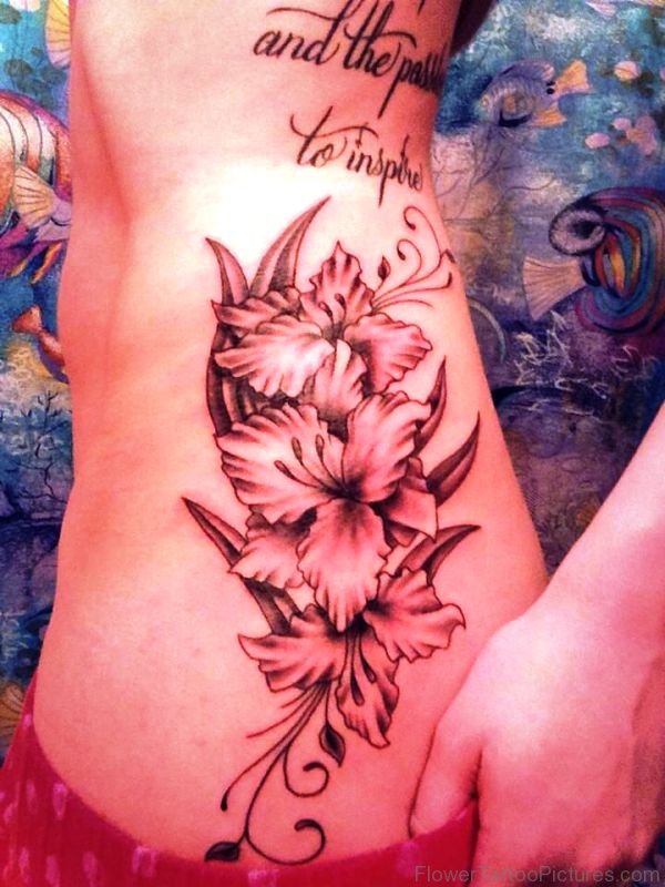Grey Inked Gladiolus Flower Tattoo On Rib