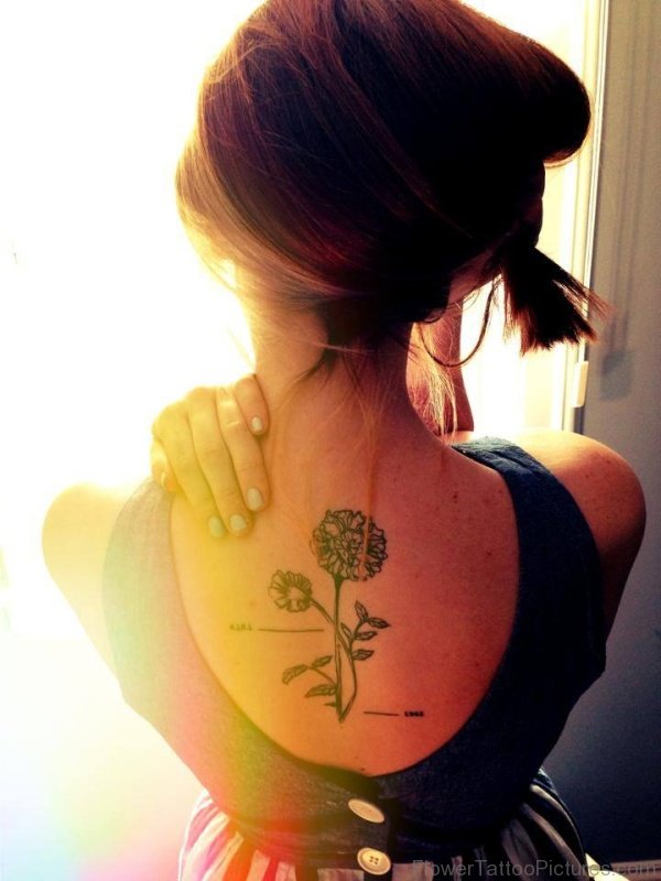 Lovely Marigold Flower Tattoo On Back