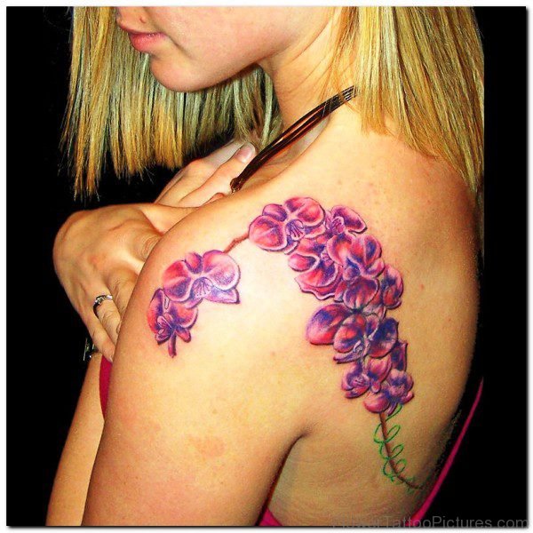 Lovely Orchid Flowers Tattoo On Shoulder