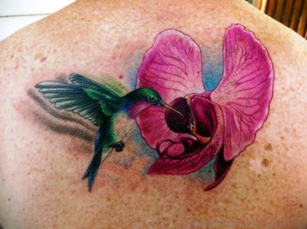 Orchid Flower With Flying Bird Tattoo On Back