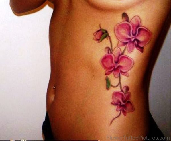 Pink Orchid Flowers Tattoo On Rib