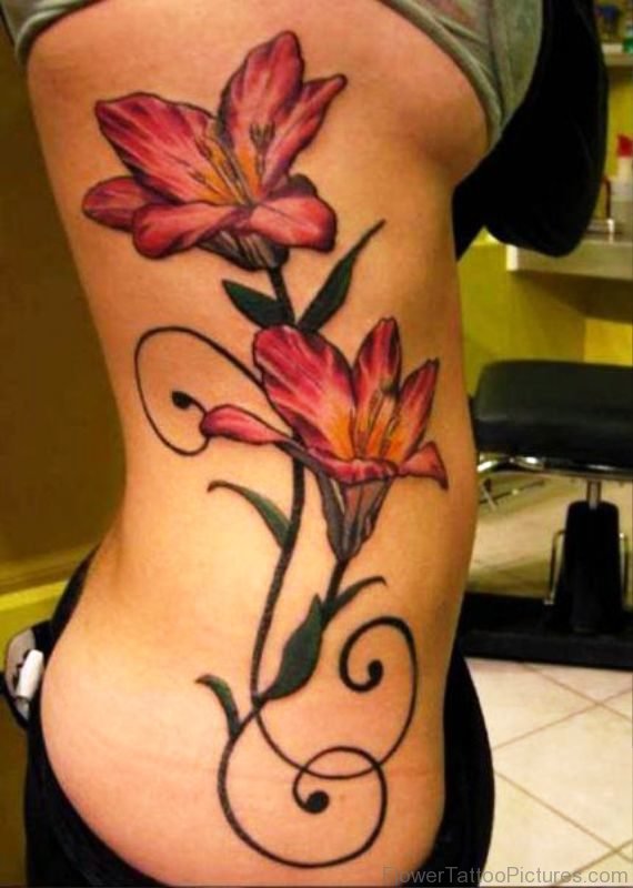 Red Larkspur Flower Tattoo On Rib