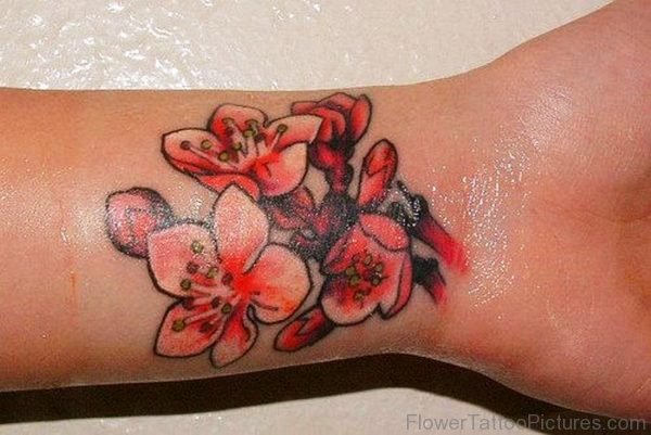 Red Orchid Flower Tattoo On Wrist