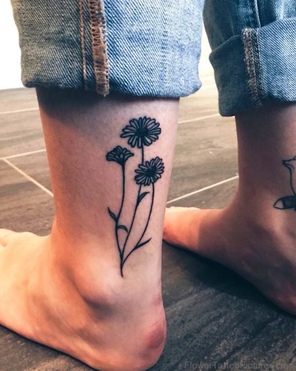 Small Black Barberton Flowers Tattoo On Leg