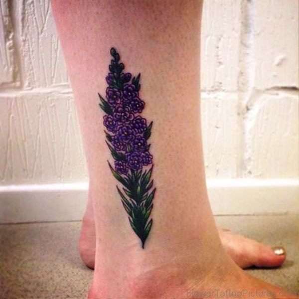 Small Larkspur Flower Tattoo On Leg