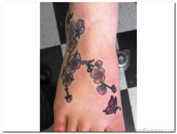 Small Orchid Flowers Tattoo On Foot