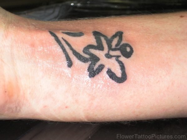 Tiny Black Daffodil Tattoo On Wrist
